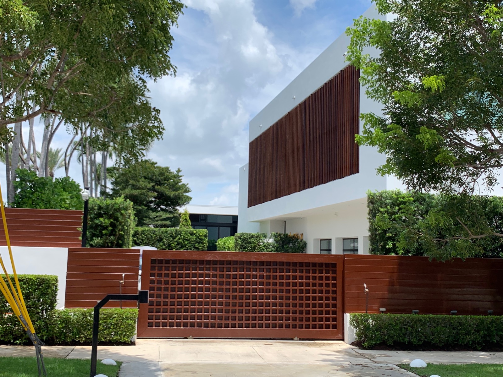 Modern residential home exterior with pool